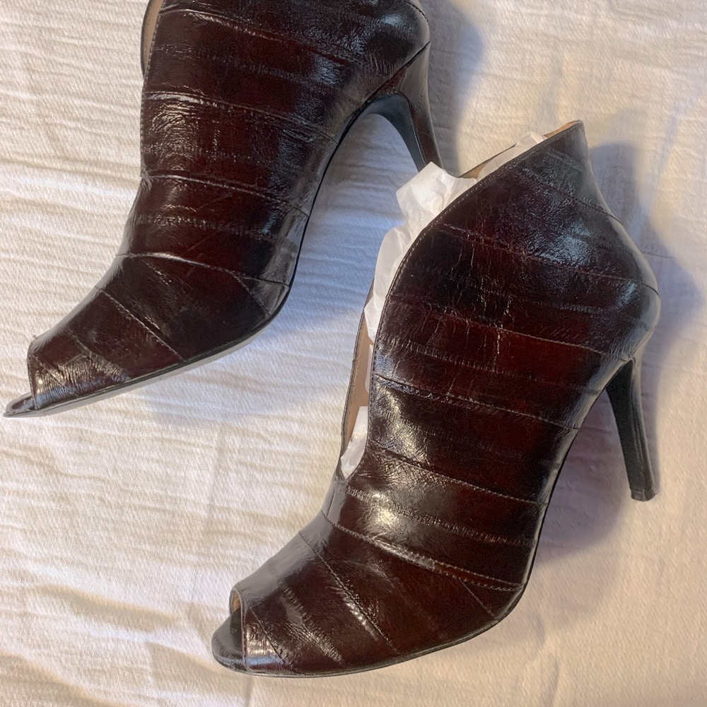 Reddish chocolate brown peep toe heels.